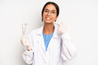 © kues1 - hispanic pretty woman smiling confidently pointing to own broad smile. dentist student concept