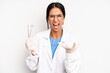 © kues1 - hispanic pretty woman looking angry, annoyed and frustrated. dentist student concept