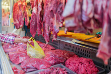 Crop Client Taking The Bag Of Meat On Market