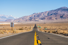 Road Amidst Barren Land At Death Valley
