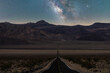 © ADDICTIVE STOCK - Scenic mountain in between asphalt highway under milky way starry sky