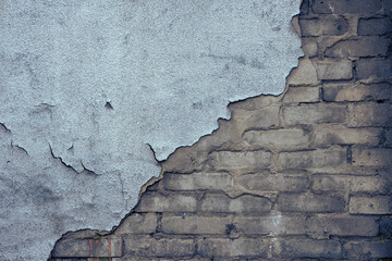 Abstract grunge texture of old colorful wall with cracks and scratches. Creative background. Blue, grey, orange and brown rough weathered stone texture with stucco and paint. Copy space