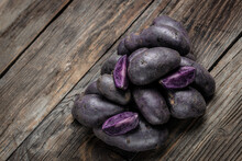 Organic Purple Sweet Potato. Raw Sweet Potatoes Or Batatas. Pomoea Batatas. Batata Potato. Vegan Food Ingredient. Banner, Menu, Recipe Place For Text, Top View
