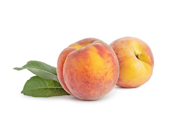 two ripe peaches on a white isolated background