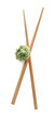 Swirl of wasabi paste and chopsticks on white background, top view