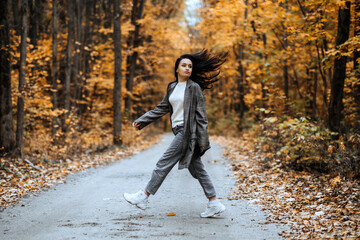 Wall Mural - Autumn Anxiety, Mental Health. Happy brunette woman enjoy life in autumn forest