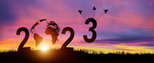 Silhouette 2023 Years In Sunset Background. Birds Carrying Number 3 While Celebrating 2023 Years. Happy New Year And Merry Christmas. Copy Space.