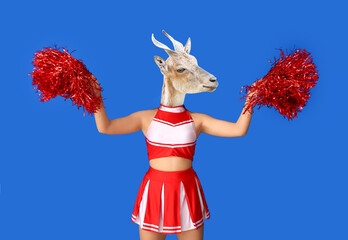 Poster - Female cheerleader with head of goat on blue background