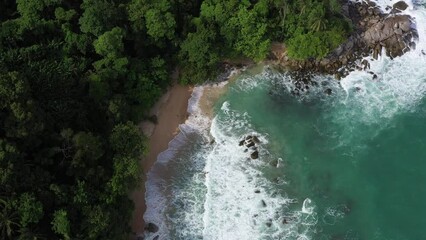 Wall Mural - Aerial drone footage of sea ocean waves reaching shore.Beach with aerial drone. Beach clear turquoise top view. Beautiful beach