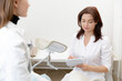 © Parilov - Gynecologist woman talk consultation with young female patient during medical in modern clinic