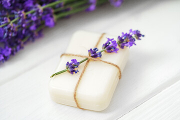 Wall Mural - Natural cube of lavender soap on white wooden background