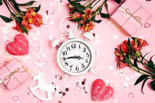 Girly Pink Background With Alarm Clock, Flowers, Gifts And Hearts. IBaby Shower Concept.