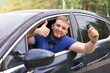 © Евгений Шемякин - portrait of cheerful guy driver young positive man driving his car, show keys, smiling show thumb up, like gesture from automobile window. Happy buyer, customer of new car enjoying driving. Good buy