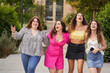 © Retamosa - group of smiling girls celebrating the holiday on the city street - Happy lifestyle and friendship