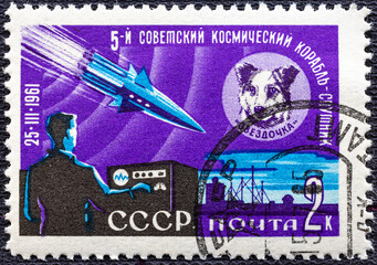 Wall Mural - Postage stamp USSR 1961.Stamp printed by Russia, shows Dog Zvezdochka and Sputnik, circa 1961