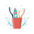 Oral care supplies illustration toothbrushes and toothpaste in a glass on a white isolated background. Vector