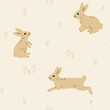 Fluffy cute brown rabbit seamless pattern, field background.