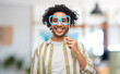 © Syda Productions - party props, photo booth and people concept - happy smiling young man with paper glasses over office background