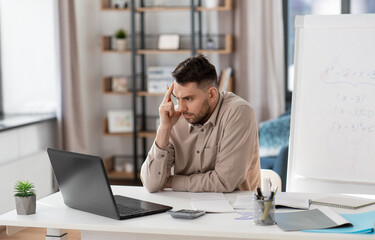 Poster - distance education, remote job and stress concept - tired male teacher with laptop computer working at home office