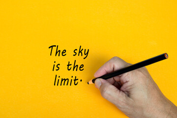 Wall Mural - THE SKY IS THE LIMIT text written on a yellow background. Business concept.