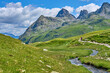 © Uwe - nice active senior woman riding her electric mountain bike in the silvretta mountain range near Gaschurn, Tyrol, Austria