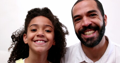 Father and daughter portraits looking at camera