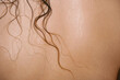 © lavrenkova - Closeup of female back with wet hair strands