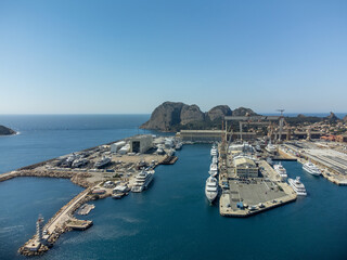 Panoramic aerial view on historical coastal Provencal city La Ciotat with large sailboat harbour and yacht shipyard, summer vacation in Provence, France