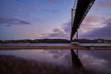 Wall Mural - Beautiful landscape with suspension 25 April bridge bridge over the Tagus river in Lisbon, Portugal.