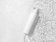 White cosmetic bottle on the water surface. Blank label for branding mock-up. Summer water pool fresh concept. Flat lay, top view.	