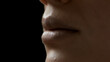 © pavel_dp - Extreme close-up shot of young African American female model's lips on black background | Lips care concept