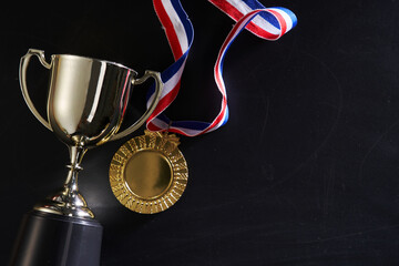 Wall Mural - medal and and trophy on blackboard  with copy space