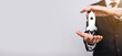 © Ivan - Startup business concept, Businessman holding tablet and icon rocket is launching and soar flying out from screen with network connection on dark background.