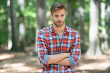 Portrait Of Young Handsome Man In Checkered Shirt Outdoor