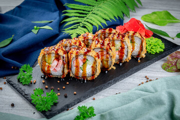 Canvas Print - Fried tempura sushi rolls with shrimp, cream cheese, gherkin in batter. Traditional Japanese Cuisine