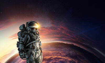 Wall Mural - astronaut walking on an unexplored planet