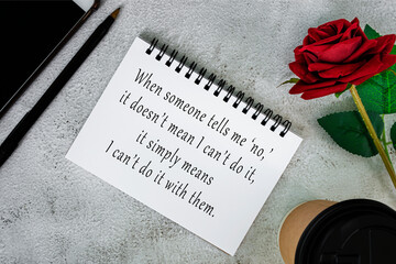 Wall Mural - Motivational and inspirational quote on a note book on white marble table.