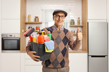 Sticker - Elderly man holding a bucket with cleaning supplies and gesturing thumbs up in a kitchen