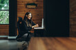 © Jacob Lund - Young businesswoman having a virtual meeting in a coworking space