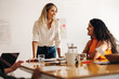 © Jacob Lund - Happy businesswomen having a meeting in a creative office