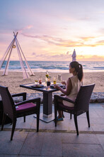 Asian Woman Dinner During Sunset On The Beach In Phuket Thailand Khao Lak