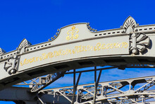 Bolsheokhtinsky Bridge, A Metal Drawbridge Across The Neva River In St. Petersburg. Inscription In Russian: Bridge Of The Emperor Peter The Great In St. Petersburg