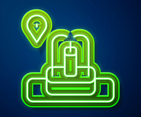 Sticker - Glowing neon line Location with fountain icon isolated on blue background. Vector