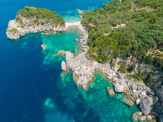 Aerial view of Limni Beach Glyko, on the island of Corfu. Greece. Where the two beaches are connected to the mainland providing a wonderful scenery. Unique double beach. Kerkyra