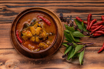 Wall Mural - Catfish Curry. Thai food on dark background. Traditional food concept. Top View, Flat Lay, Copy Space