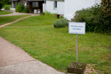 Fototapeta Londyn - a sign informing about the boundaries of the area for women in the meditation center