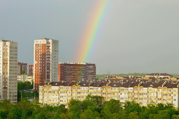 Wall Mural - Double rainbow over the city after the rain.