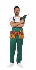 Wall Mural - Young worker in uniform with power drill on white background