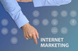 © New Africa - Internet marketing. Different icons and businessman on light blue background, top view