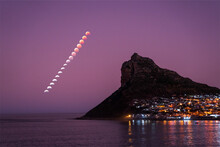 View Of Super Flower Blood Moon Lunar Eclipse Of 16 May 2022 From Hout Bay, Cape Town, Western Cape, South Africa.
